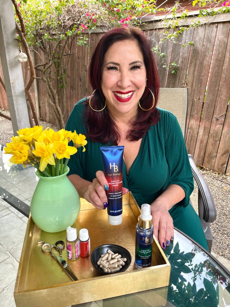 woman in green top holding conditioner