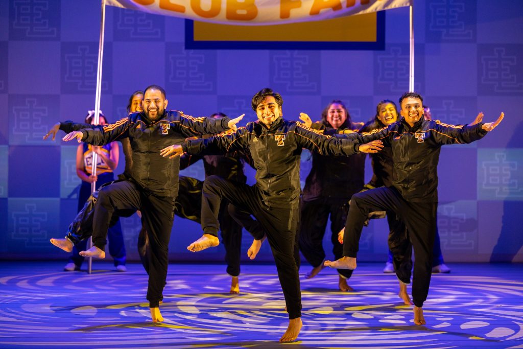 A group of indian dancers in tracksuits